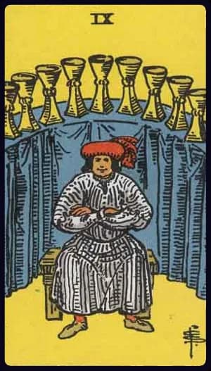 La carte Neuf de Coupe du tarot Rider-Waite-Smith